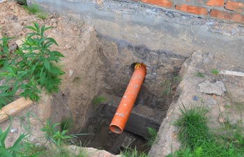 Sanitary Sewer Pipe in the House Foundation