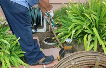 a worker providing septic tank inspection